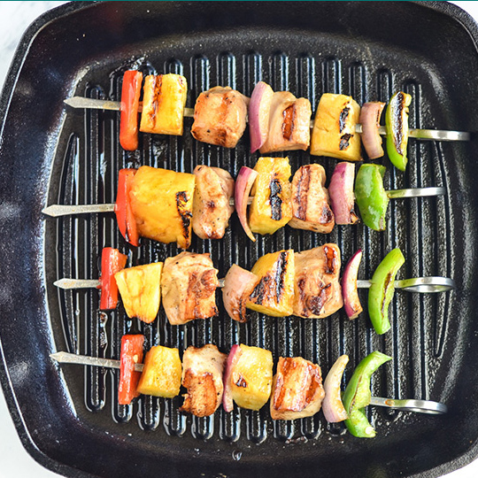 Grilled pineapple chicken kebobs on grill pan