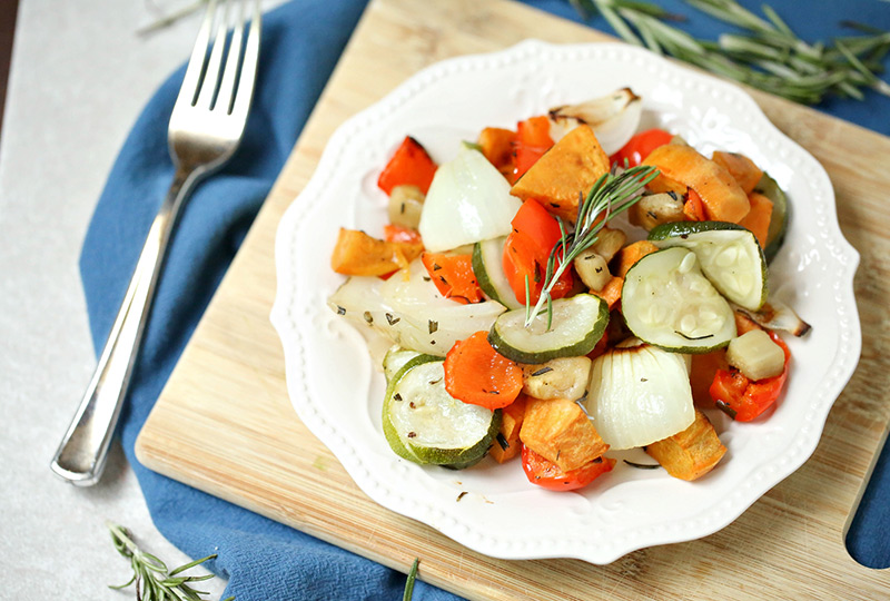 Mixed roasted vegetables on a white plate