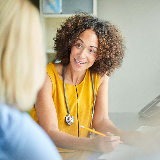 Patient speaking with primary care physician.