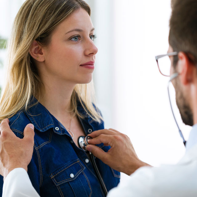 Doctor evaluating patient's heart for any signs of AAA.