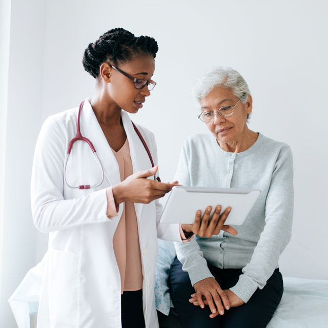 Patient speaking to her doctor during her Medicare annual wellness visit.