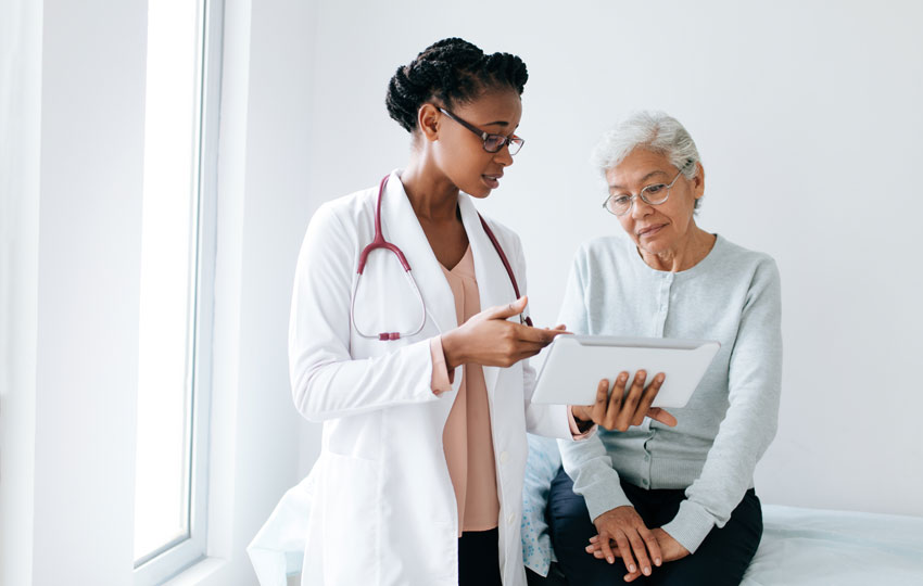 Patient speaking to her doctor during her Medicare annual wellness visit.
