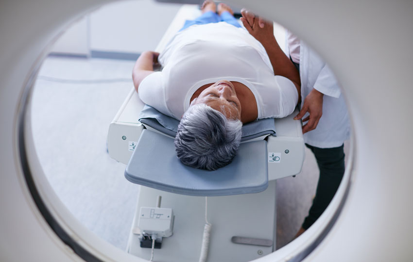 Patient entering a CT scan for lung screening.