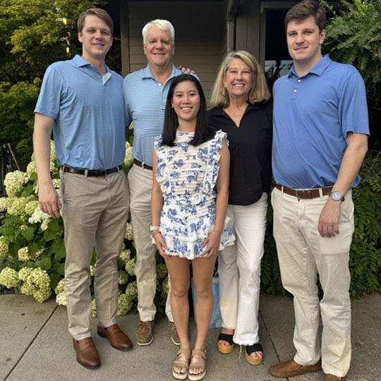 The Hornsby family poses, standing, for an outdoor photo. Kidney transplant patient Rachel Hornsby is wearing a black shirt.