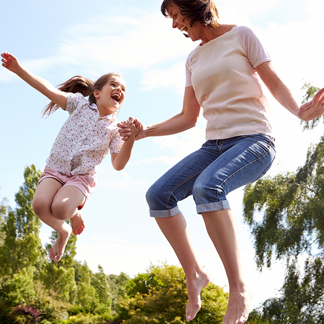 woman and child jumping