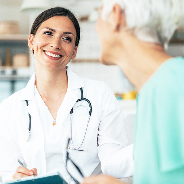 Mature woman talking to doctor