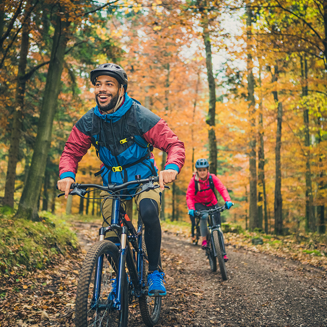 2 people mountain biking