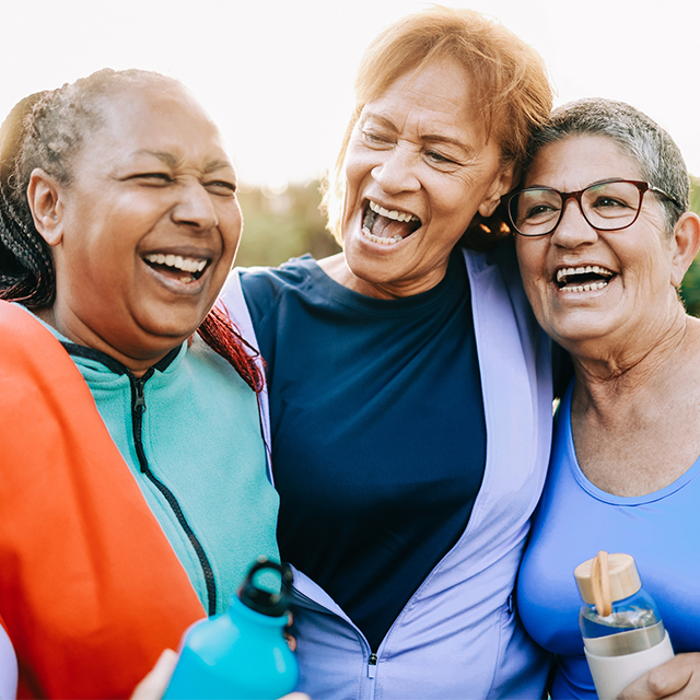 Friends enjoying a laugh together. Older women in exercise clothes